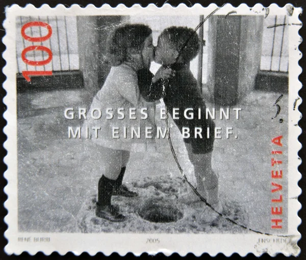 SWITZERLAND - CIRCA 2005: A stamp printed in Switzerland shows image to two boys kissing, great start with a brief, circa 2005
