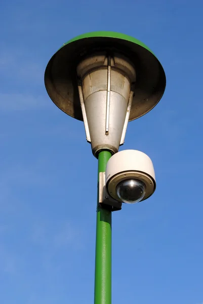 Speed dome on a green street lamp