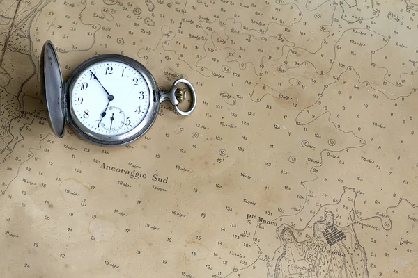 Old watch on a nautical map