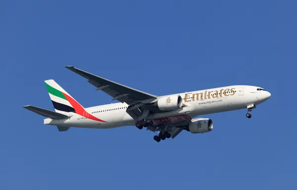 Boeing 777-200 of Emirates Airlines preparing for landing in Doha, Qatar