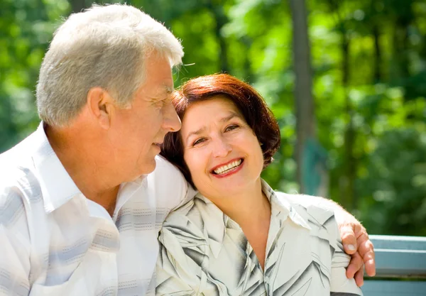 Senior happy couple embracing, outdoors