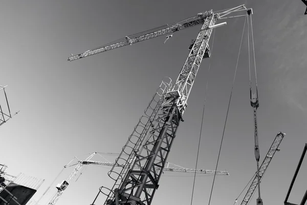 Construction crane, black and white