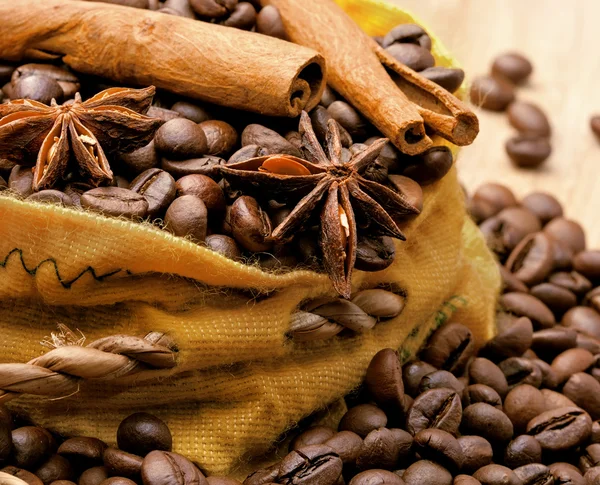 Coffee beans, cinnamon and anise in a bag