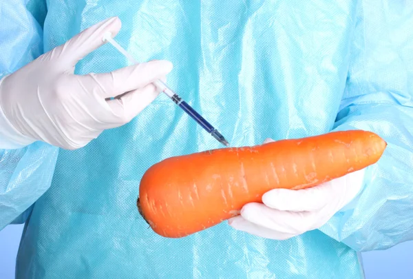 A scientist holds a genetically modified vegetable