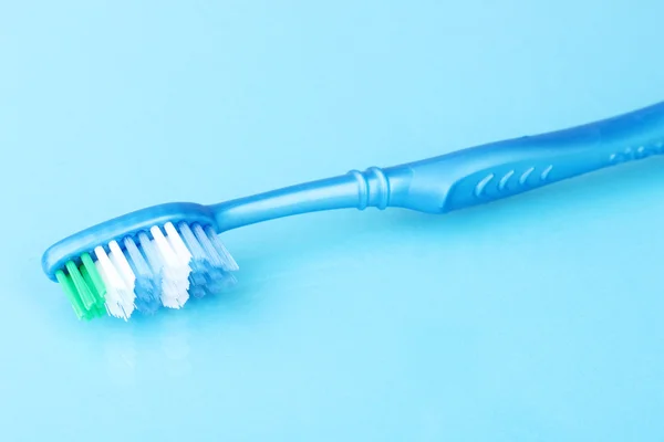 Toothbrush on blue background
