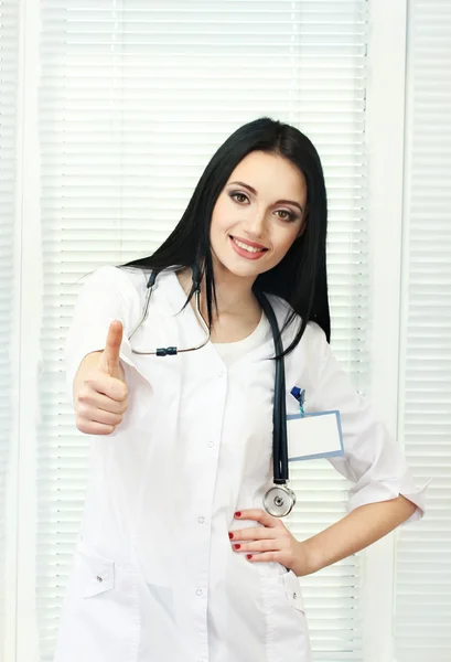 Young beautiful doctor with stethoscope