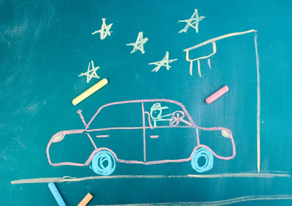 Car on road, child\'s drawing with chalk