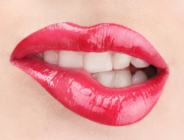 Beautiful make up of glamour red gloss lips