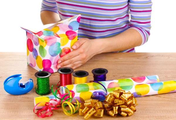 Wrapping presents surrounded by paper, ribbon and bows — Stock Photo #9940696