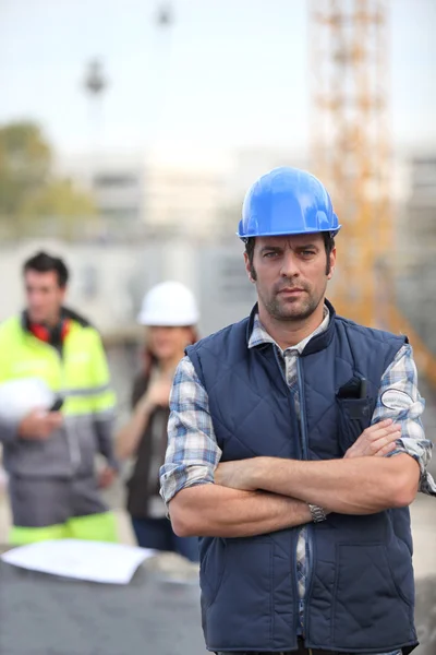 Foreman stood in front of two colleagues