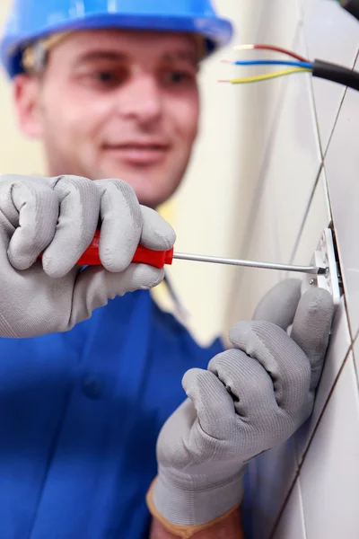 Closeup of an electrician at work