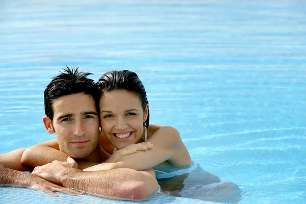 Beautiful couple in a swimming pool