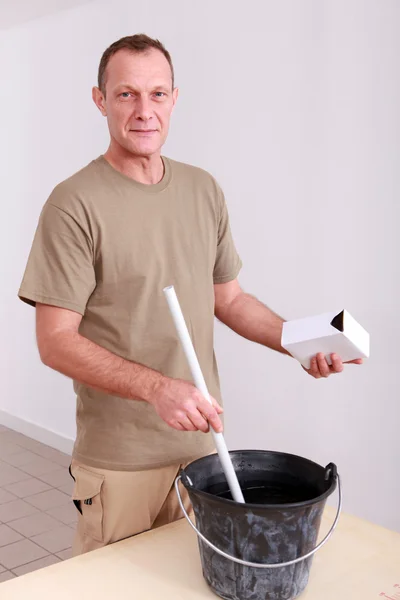 Man mixing plaster