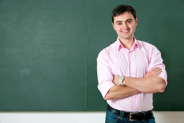 Student or teacher at the blackboard