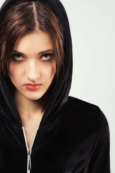 Angry woman in black hood