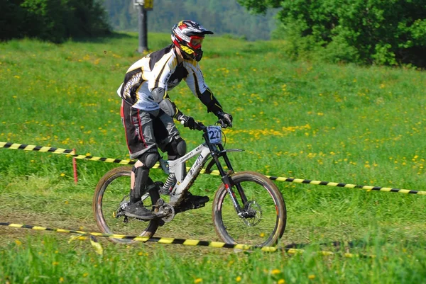 A young male riding a mountain bike outdoor