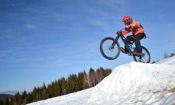 Downhill mountain bike in snow