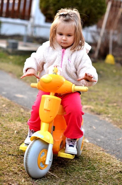 Baby riding on motorbike