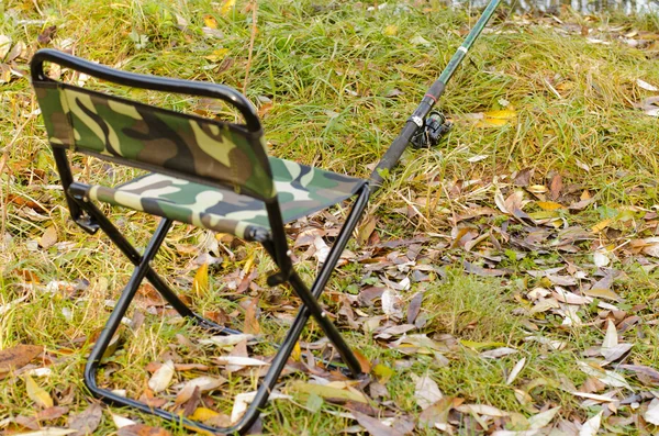 Fishing tackle ashore about a fishing chair