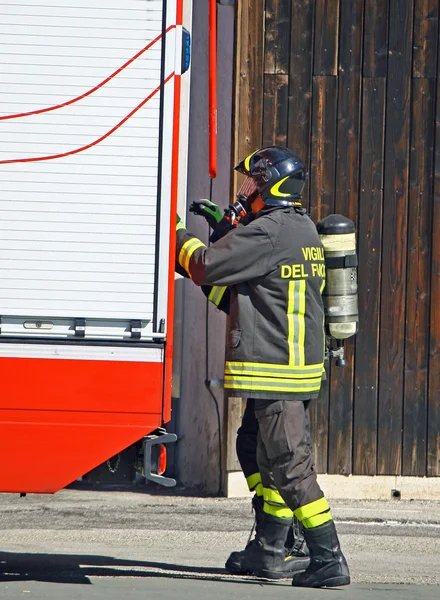 Firefighter with oxygen cylinder and open the fire trucks