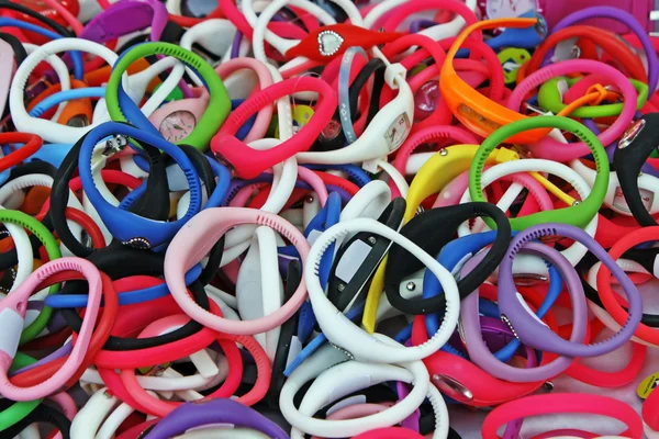 Colored rubber bracelets, watches for sale at the local market for kids