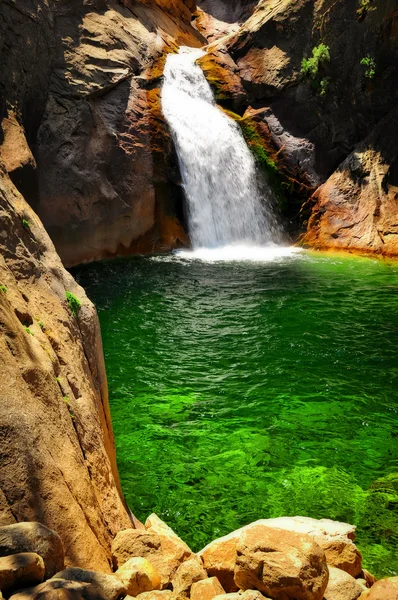Waterfall with green water in King\'s Canyon