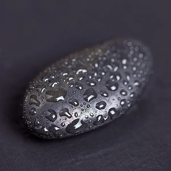 Black Stone with water drops