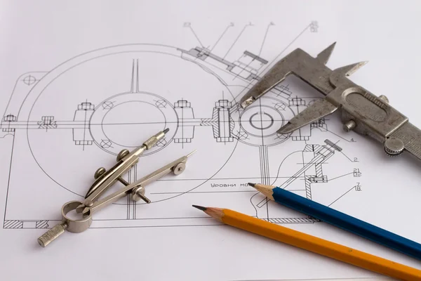 Tools on the background of technical drawings