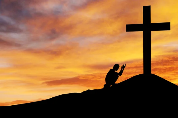 Man praying under the cross