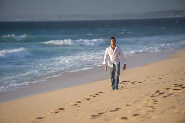Man walking alone at the beach