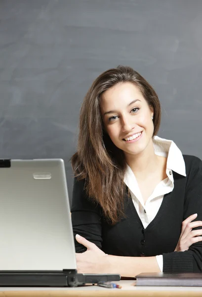Portrait of a young beautiful woman with laptop