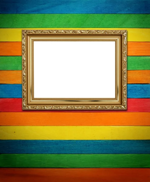 Gold frame on colorful wood Background