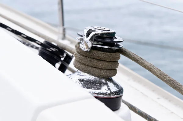 Sailing boat winch with mooring line attached