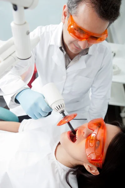 Dentist using laser — Stock Photo #8851281