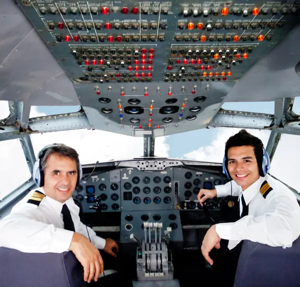 pilots in an airplane cabin