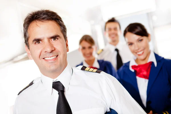 Captain with cabin crew