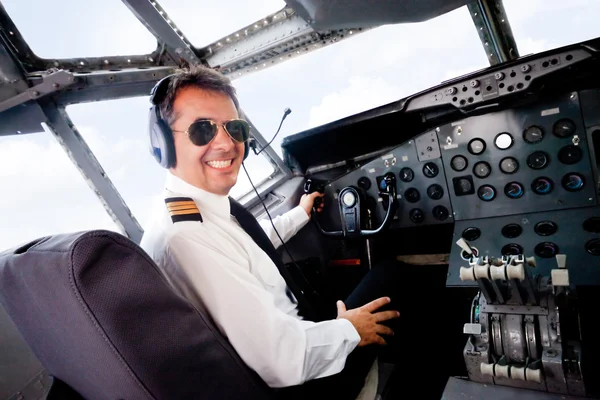 pilot in an airplane cabin