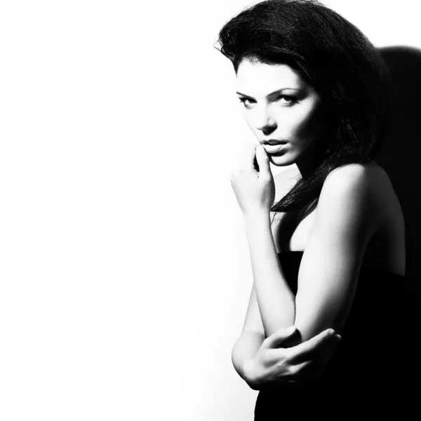 Fashion portrait of beauty woman, black and white, high contrast, studio sh