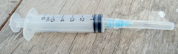 Disposable syringe over white background