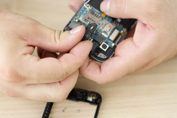 Fixing Smart Phone — Stock Photo #8553154