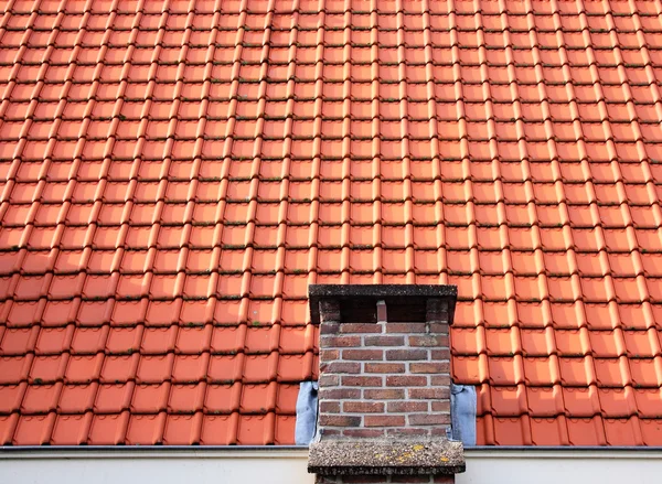 Red roof tiles with chimney