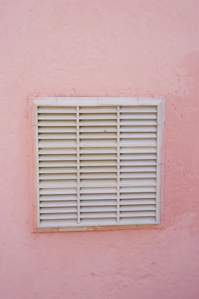 Air vent on pink building in Ischia
