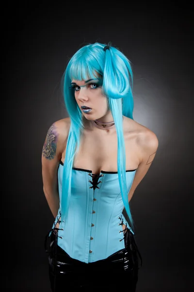 Cyber gothic girl in blue vinyl outfit