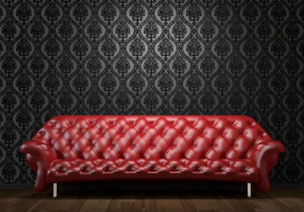 Red leather couch on black wall