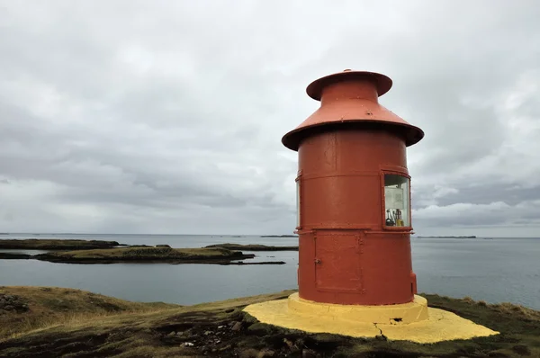 Sea lighthouse at West Iceland coast.