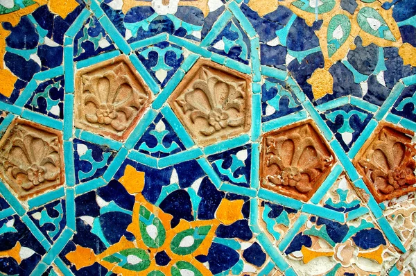 Fragment of tiled wall with Arabic mosaic