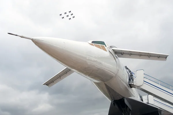 Russian airplane TU-144 and eight planes in sky