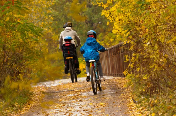 Active family cycling on bikes outdoors