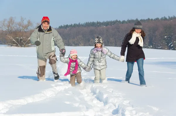 Happy family winter fun outdoors