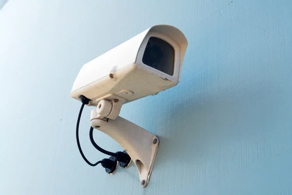 Security surveillance camera on a wall